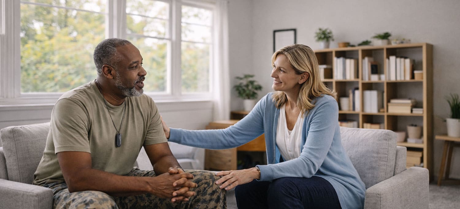 A counselor providing behavioral health support to a veteran at Reveille Foundation